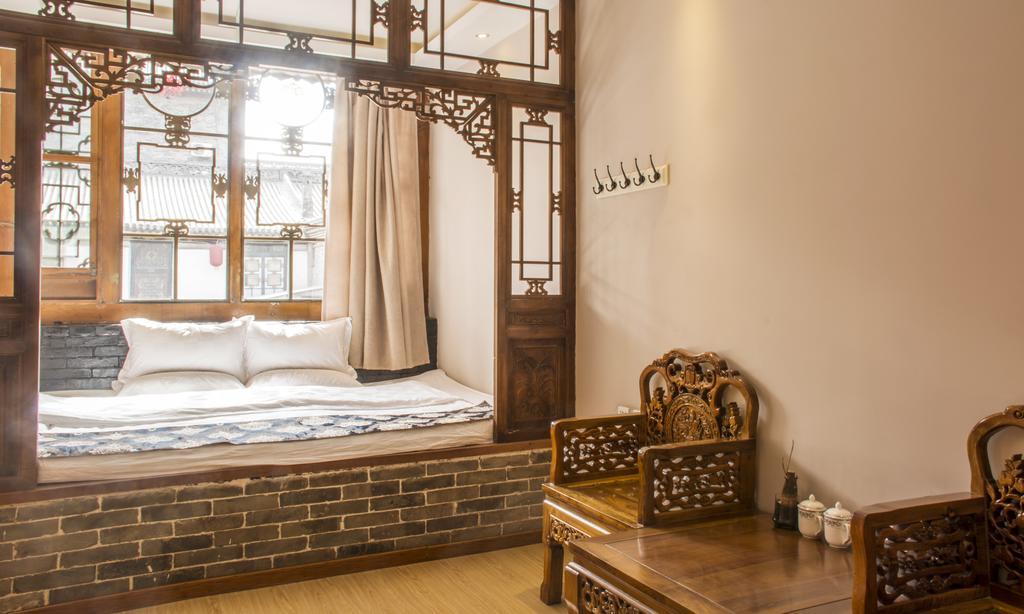 Fly By Knight Pingyao Courtyard Hotel Bagian luar foto