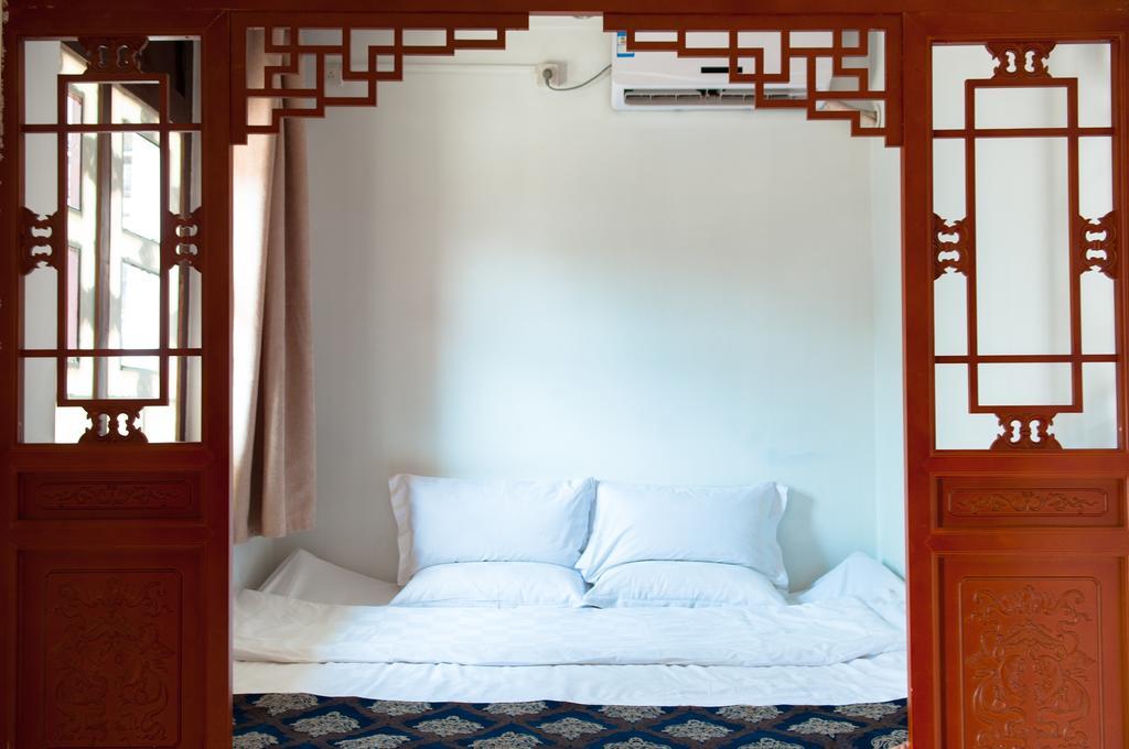 Fly By Knight Pingyao Courtyard Hotel Bagian luar foto